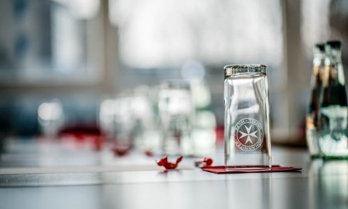 Water glasses and bottles on a conference table