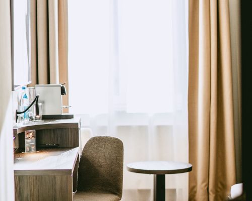 Practical workspace by the window with a bright and pleasant room atmosphere