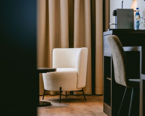 Cozy seating and workspace for relaxing moments during your stay.