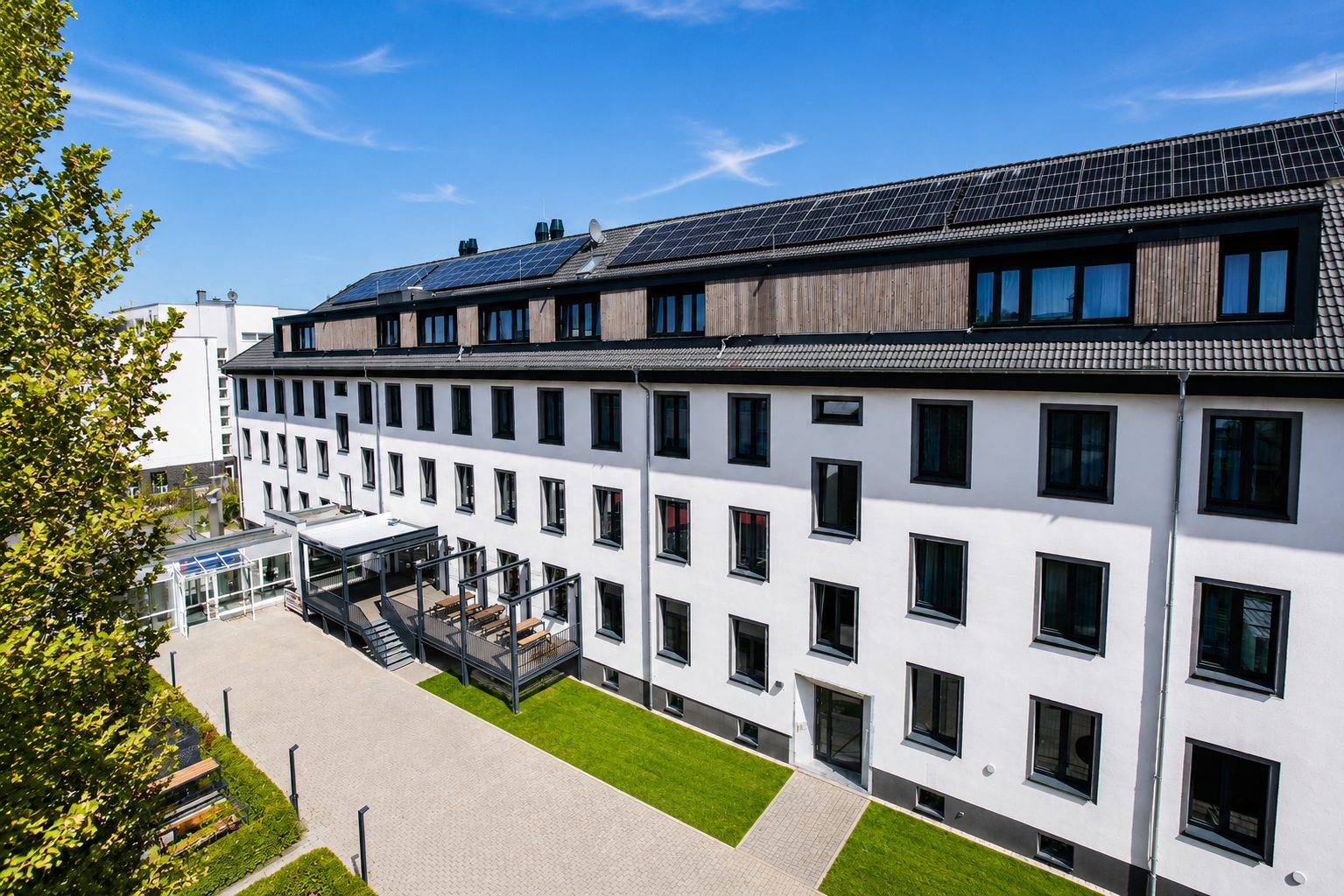Das Johanniter Gästehaus Münster von außen Gebäude und Eingang aus Vogelperspektive