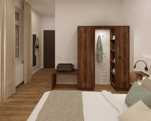 Zimmeransicht mit Doppelbett, Schreibtisch und Garderobe