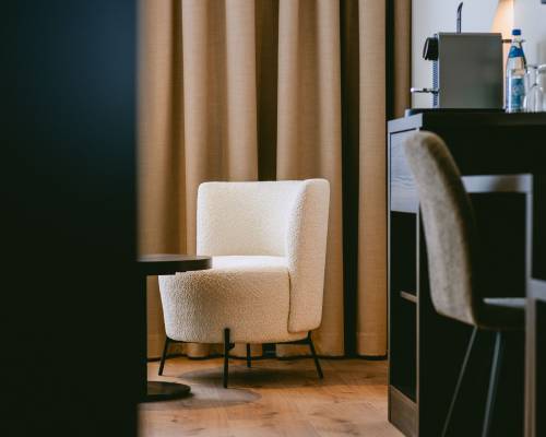 Cozy seating and workspace for relaxing moments during your stay.